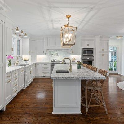 kitchen white cabinets gold light fixture island barstools